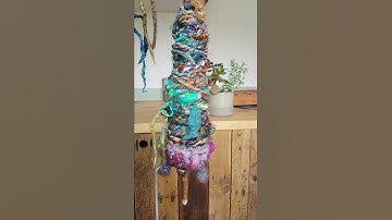 Handspun Yarn In Progress Of Plying On The Spindle