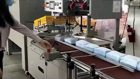 Automatic sealing shrinking machine for stack masks packaging
