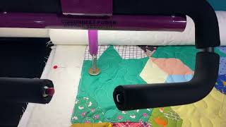 Four long arm quilting machines all quilting at the same time. 