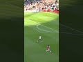 Kane attempts a slide tackle as saka scores