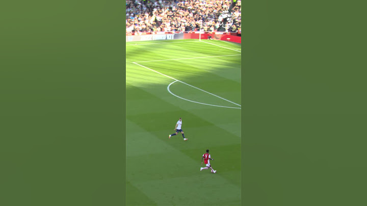 Kane attempts a slide tackle as Saka scores!