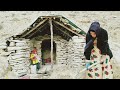 Covering the roof of the house in a traditional way by Zari, a displaced nomadic woman