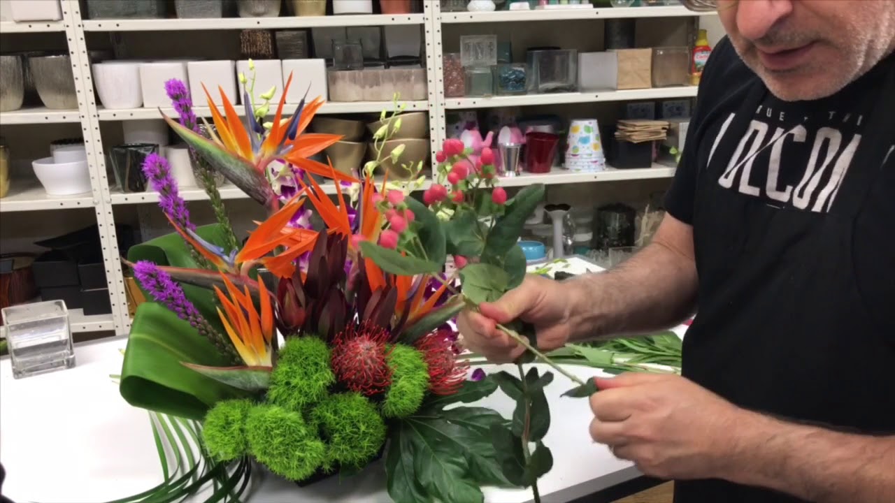 DIY tropical flower arrangement with birds of paradise