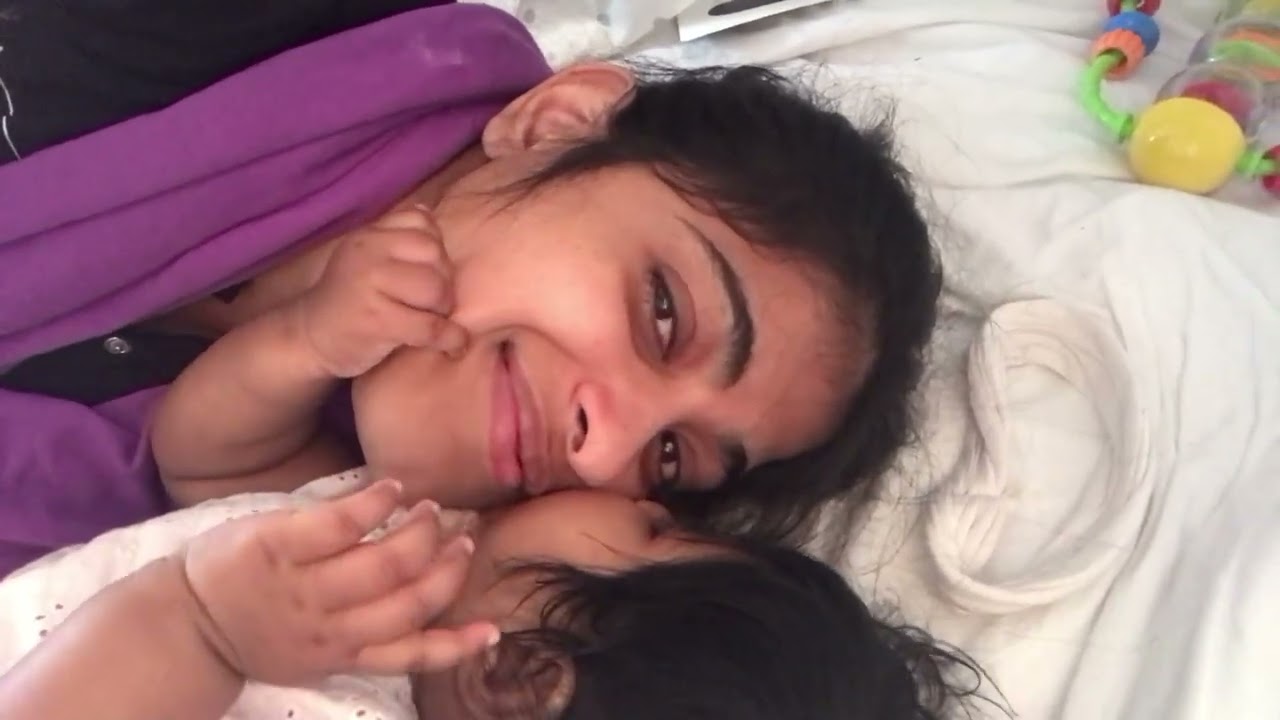 Hungry baby sucking mammas face