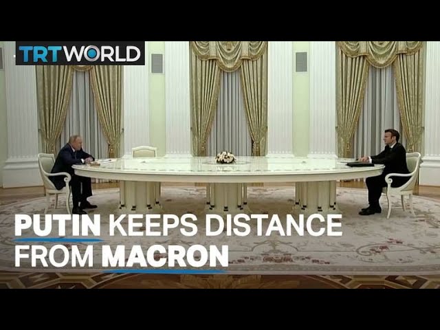 Putin meets Macron in Moscow but keeps him away with a long table