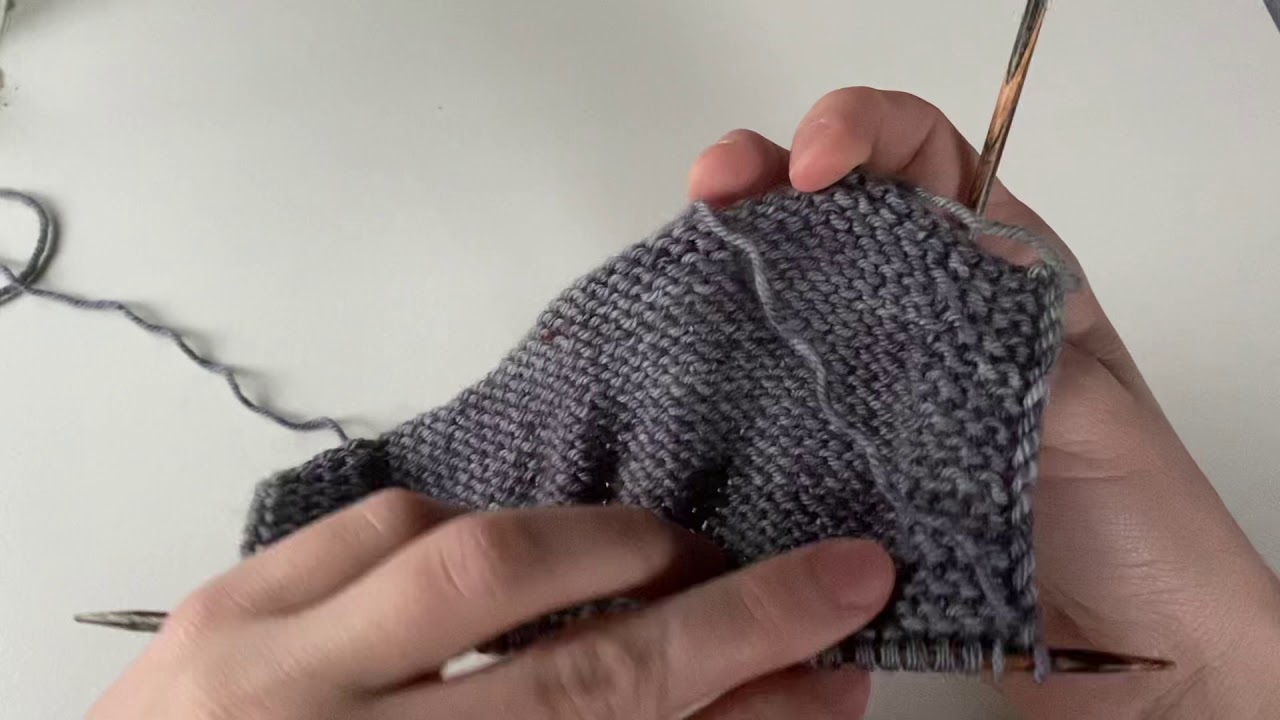 Folding the edge and knitting stitches together