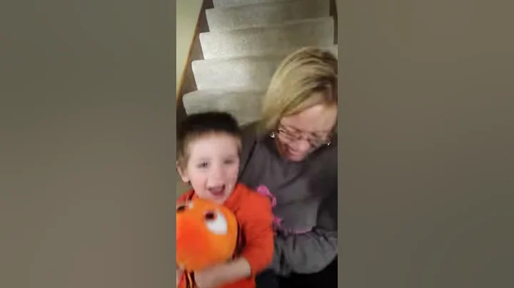 Vicki and Braxton sliding down the stairs