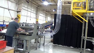 Rennco's Vertical Cup Counter Loader (VCCL) with cup blower