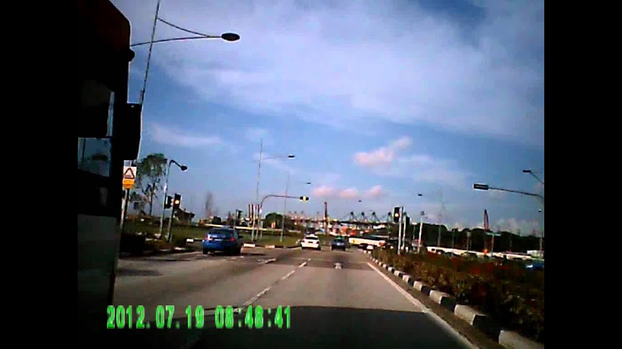 Comfort Delgro Bus beating traffic light