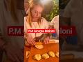 Prime Minister Giorgia Meloni makes a cake for Donald Trump