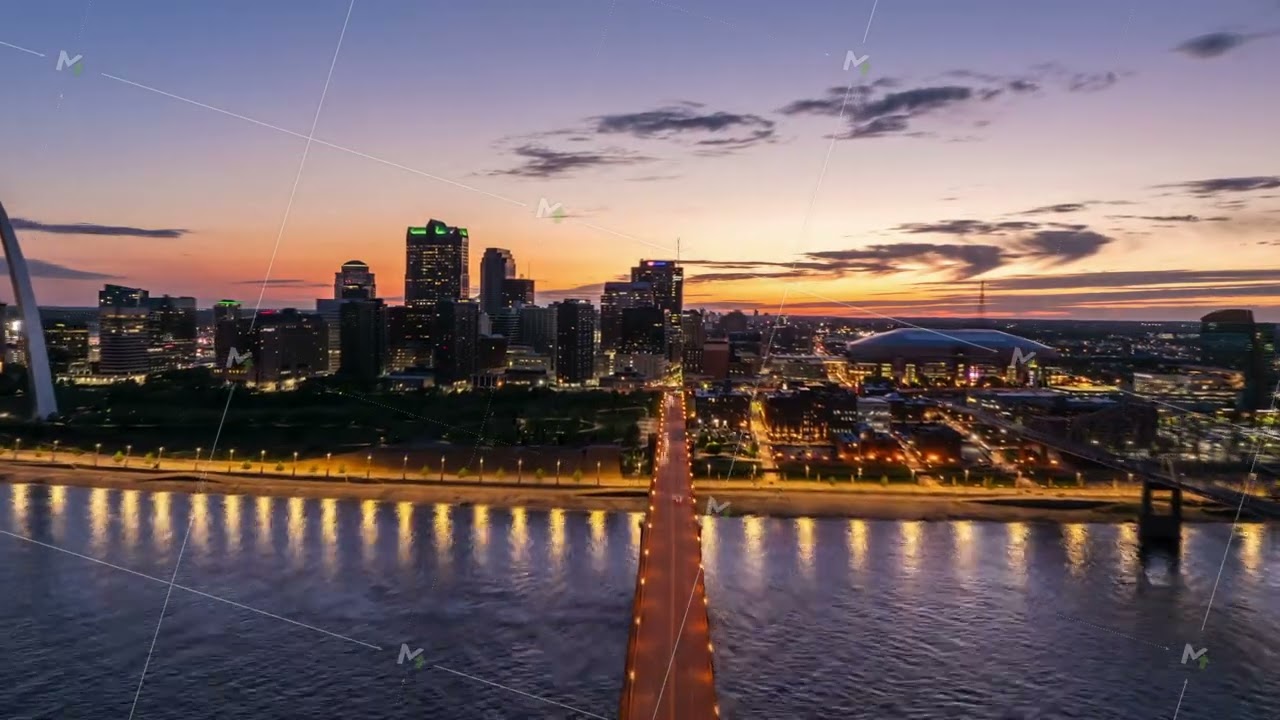 Aerial Hyperlapse view of the St. Louis skyline at sunrise, featuring the iconic gateway arch and