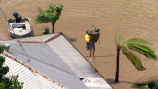 Australia: Helicopter crew rescues man trapped by floods | AFP