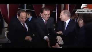 Vladimir Putin gives Egyptian president Abdel Fattah al-Sisi a Kalashnikov