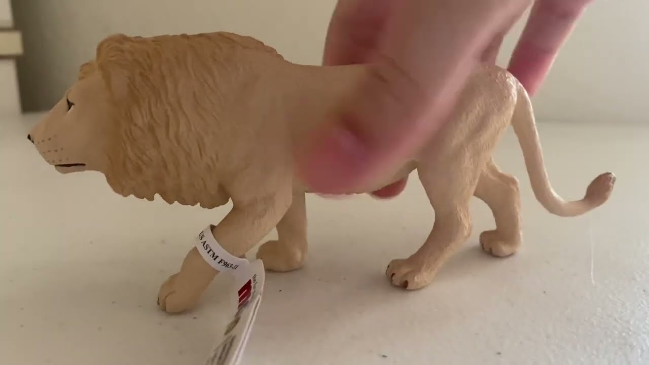 Mojo white lion figurine.