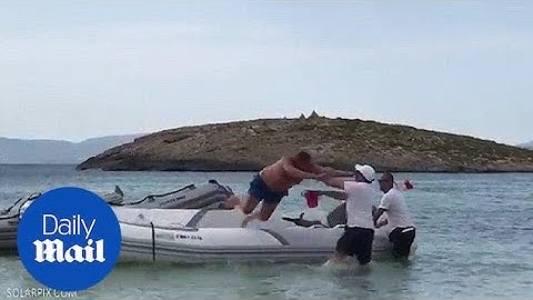 Hilarious moment holiday maker tries to fight man over dinghy - Daily Mail