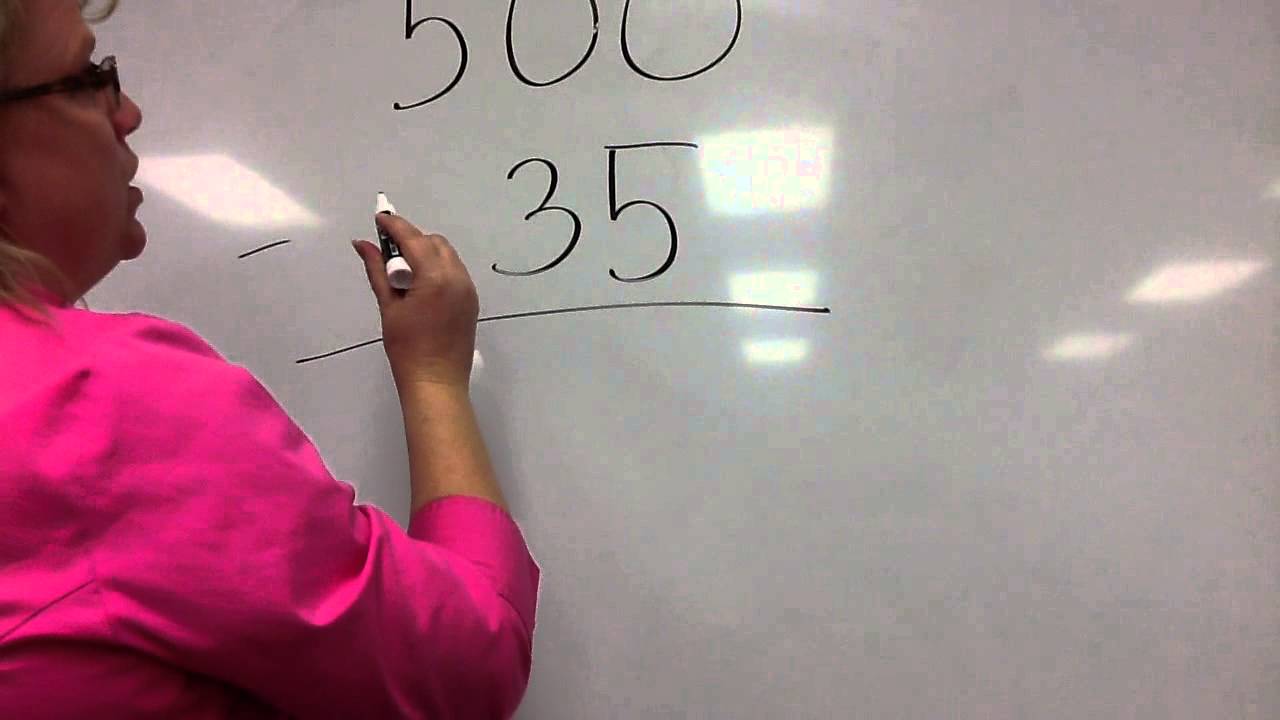 Subtracting across zeros - YouTube