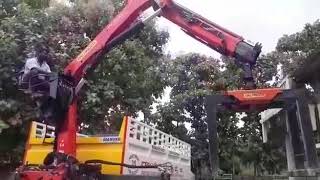 Concrete blocks loading and unloading by Palfinger truck mounted crane