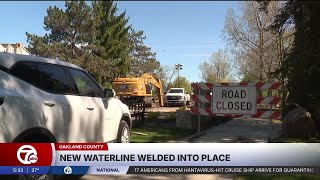 Crews race to repair Oakland County water main break, residents face days without water