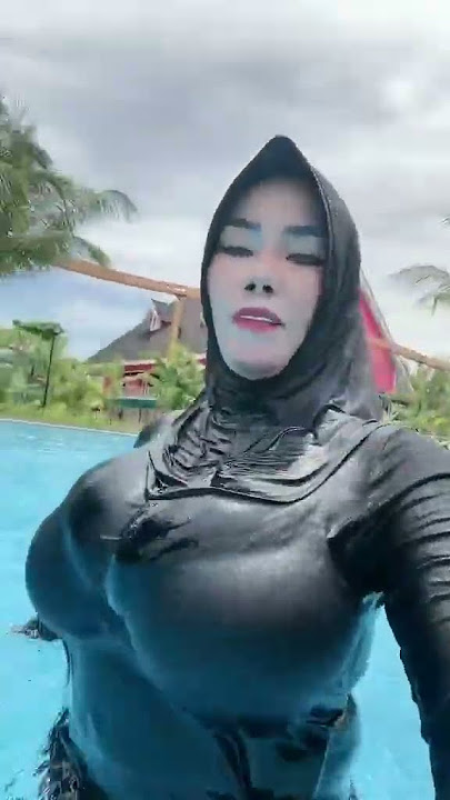 Muslim girl swimming with Islamic hijab and her big boobs