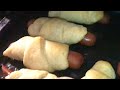 making PIGS-IN -A-BLANKET (crescent rolls and hotdogs)