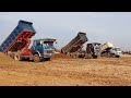 Amazing Dump trucks operation fast soils unloading filling the big lake