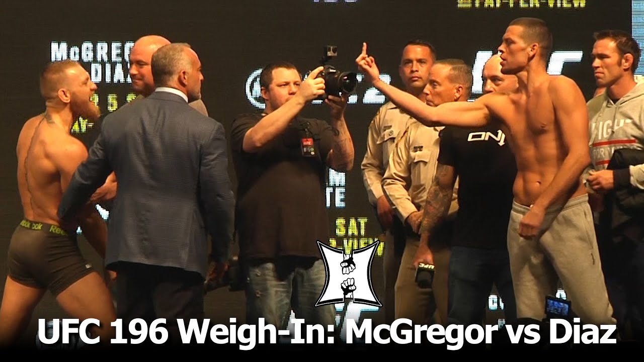 UFC 196 Conor McGregor + Nate Diaz WeighIn And Stare Each Other Down. It’s On! YouTube
