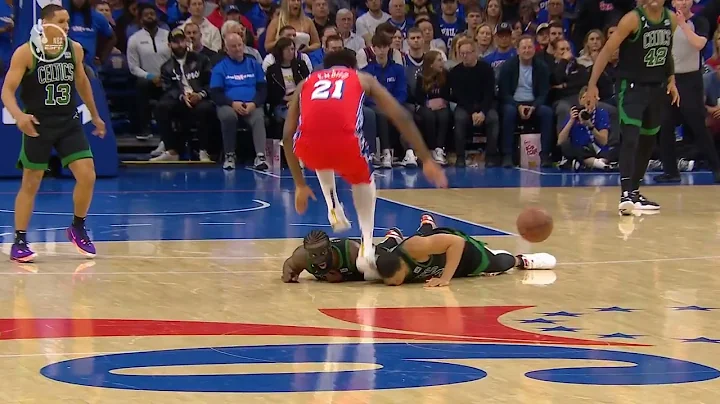 Joel Embiid unintentionally stomps on Grant Williams head while hustling for a loose ball.