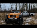 Jeep attempts to recover f250 stuck in mud