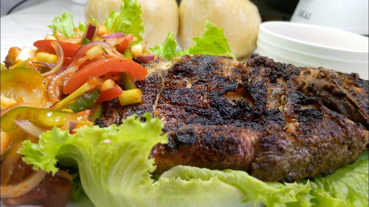 charcoal grilled tilapia with banku...seafoodstreetfood YouTube