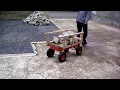 重いコンクリートを運搬するのに女性が一輪車ではキツイので片手で引っ張れるビッグカートに積んでみた