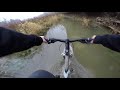 Mountain biking in the deep water, rocky river trail