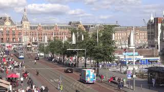 Traffic of Cars, Trams and People Near the Amsterdam Centaal. Fast Motion