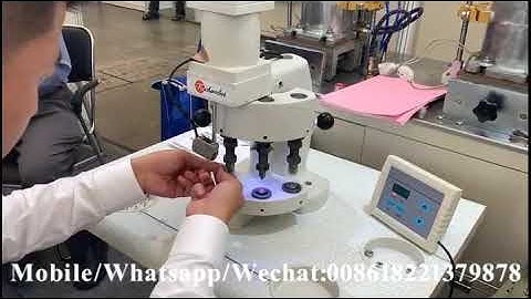 Three heads electromagnet snap button attaching machine