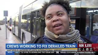Crews work to fix derailed train