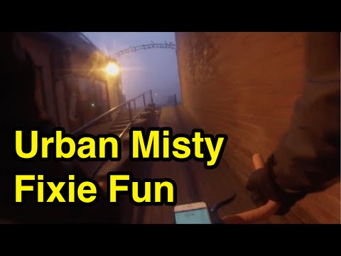 Urban Fixie Riding In The Mist At Night 