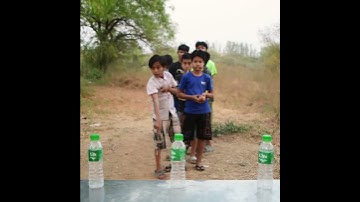 "DIY Ring Toss Game with Water Bottles – Fun & Easy Recycling Activity!"