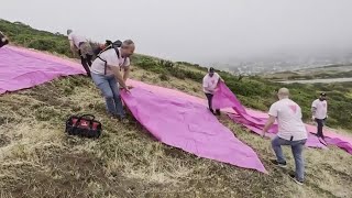 Pride volunteers set up famed Pink Triangle on Twin Peaks in San Francisco