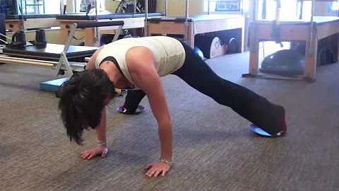 Stephanie Scarbrough demonstrates a Pilates exerci...