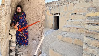 Download Lagu De magische grot en schuilplaats versterken: een nomadische vrouw bouwt een stenen pilaar. MP3