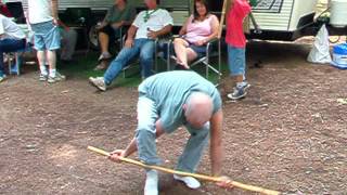 stepping through a broom