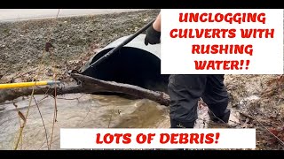 MASSIVE AMOUNT OF DEBRIS/LIMBS IN FRONT OF CULVERTS 03/2024