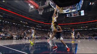 Kristaps Porzingis tries to contest vertically, but commits a shooting foul with his unicorn