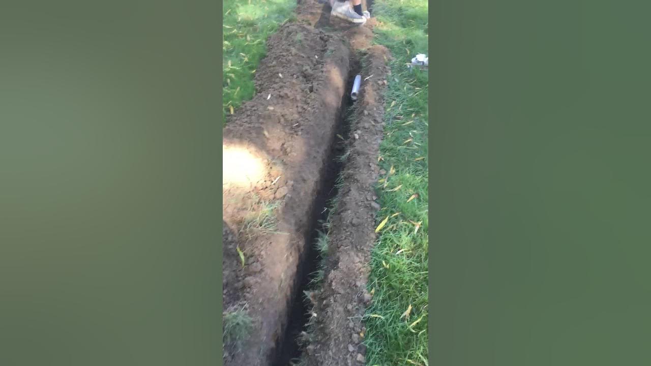 How to trench in sump pump discharge piping YouTube