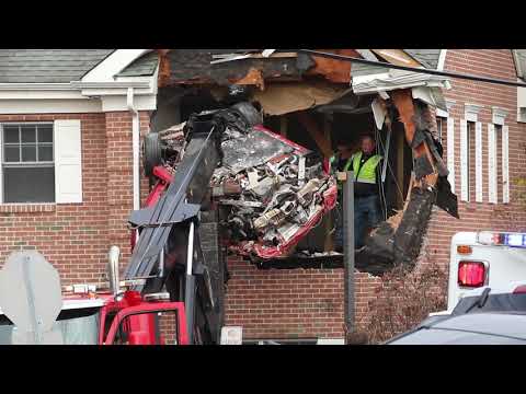 Porsche removed from second story of building after crash