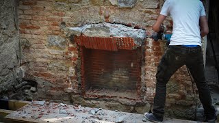 Demolition day, revealing the original fireplace.