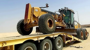 CAT 14M GRADER LOADING ON TRAILLER