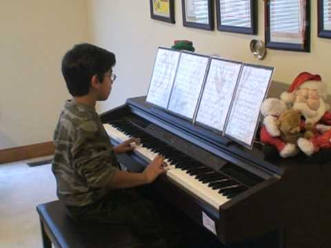 9-year old Nikhil Kuppuswamy playing the Piano sol...