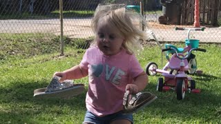 Baby Puts Flower In Her Hair After Putting Shoes On Mommys Feet