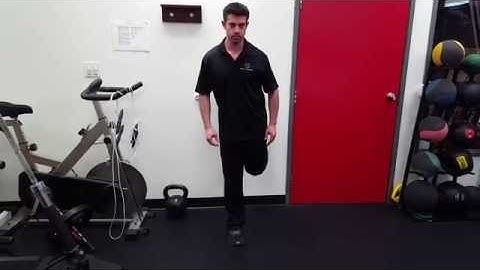 Standing Wall Supported Right Knee Flexion w/ Left Glute Med & Right TR