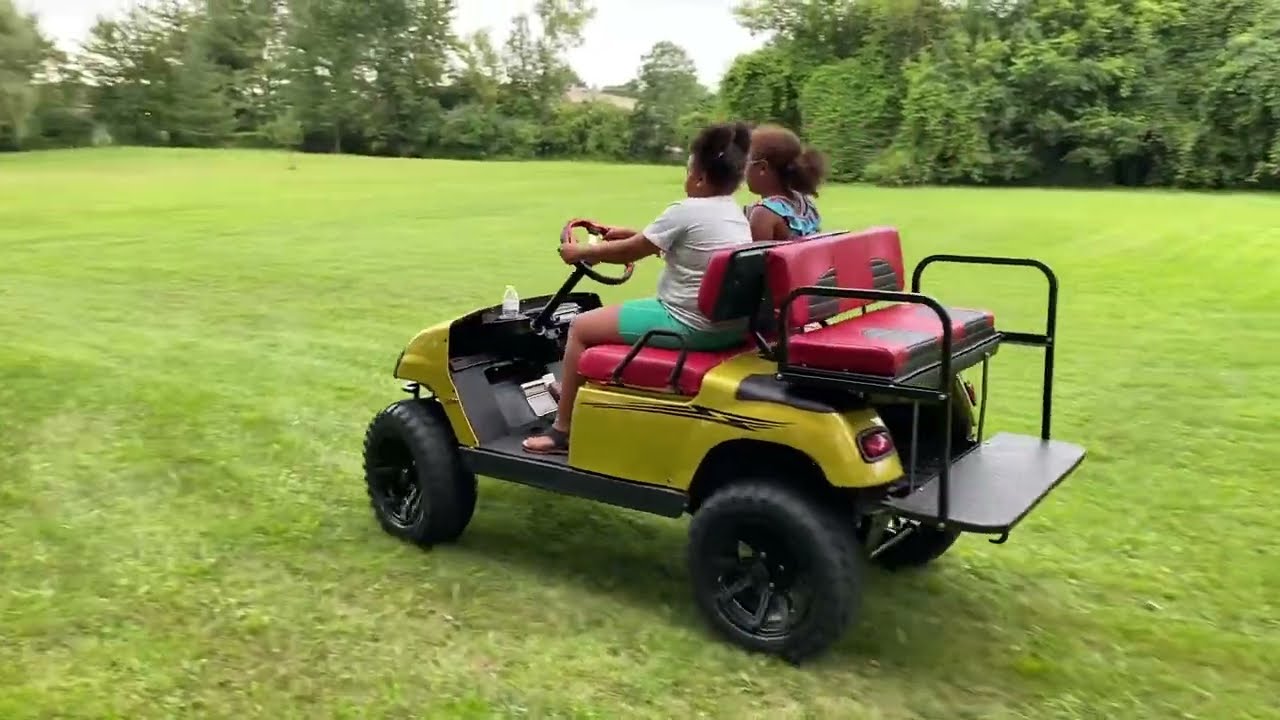 ￼ teaching my girls how to drive the golf cart